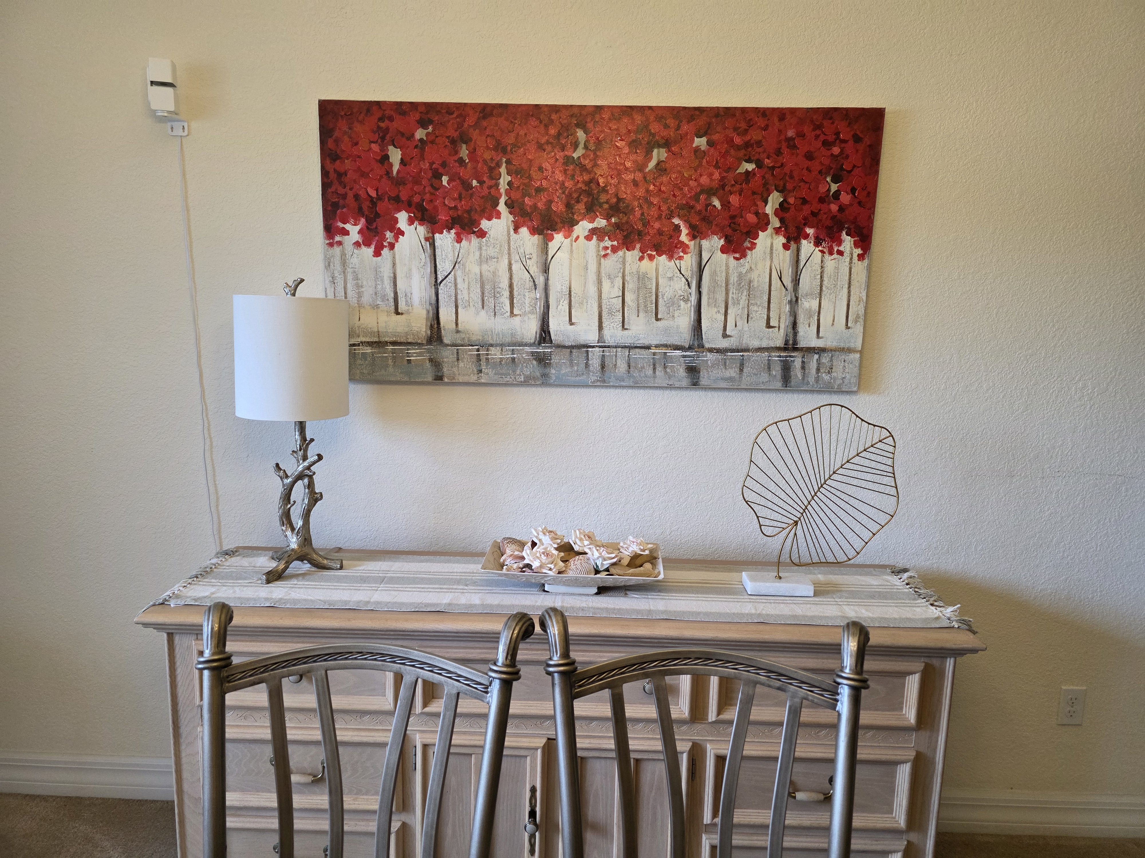 Dining room artwork and sideboard details