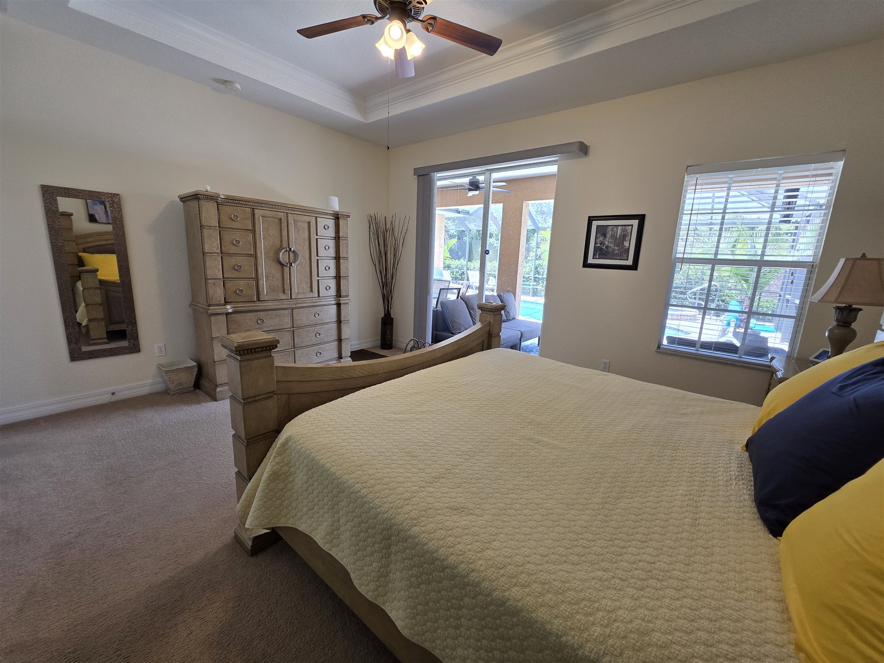 Primary suite bed and lanai view
