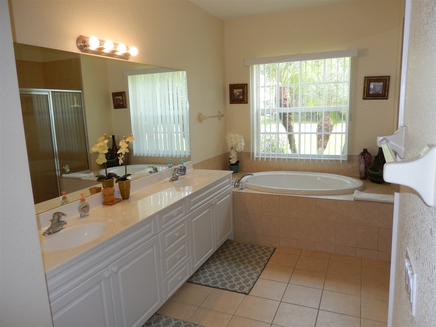 Primary bathroom vanity and tub